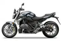 Elegantes schwarzes BMW R1200R-Motorrad mit sportlicher Optik und offenen Motorenteilen.